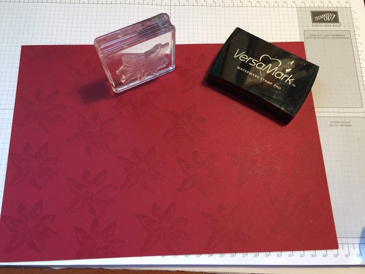 Cherry Cobbler cardstock stamped with image from Reason For The Season stamps set inked up with Versamark.